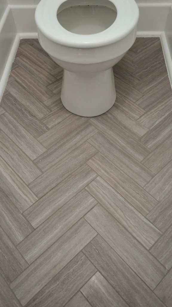 Peel and stick vinyl tile in herringbone pattern