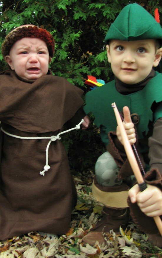 Unhappy baby in costume
