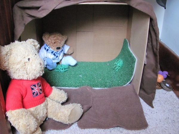 Cardboard box teddy bear den